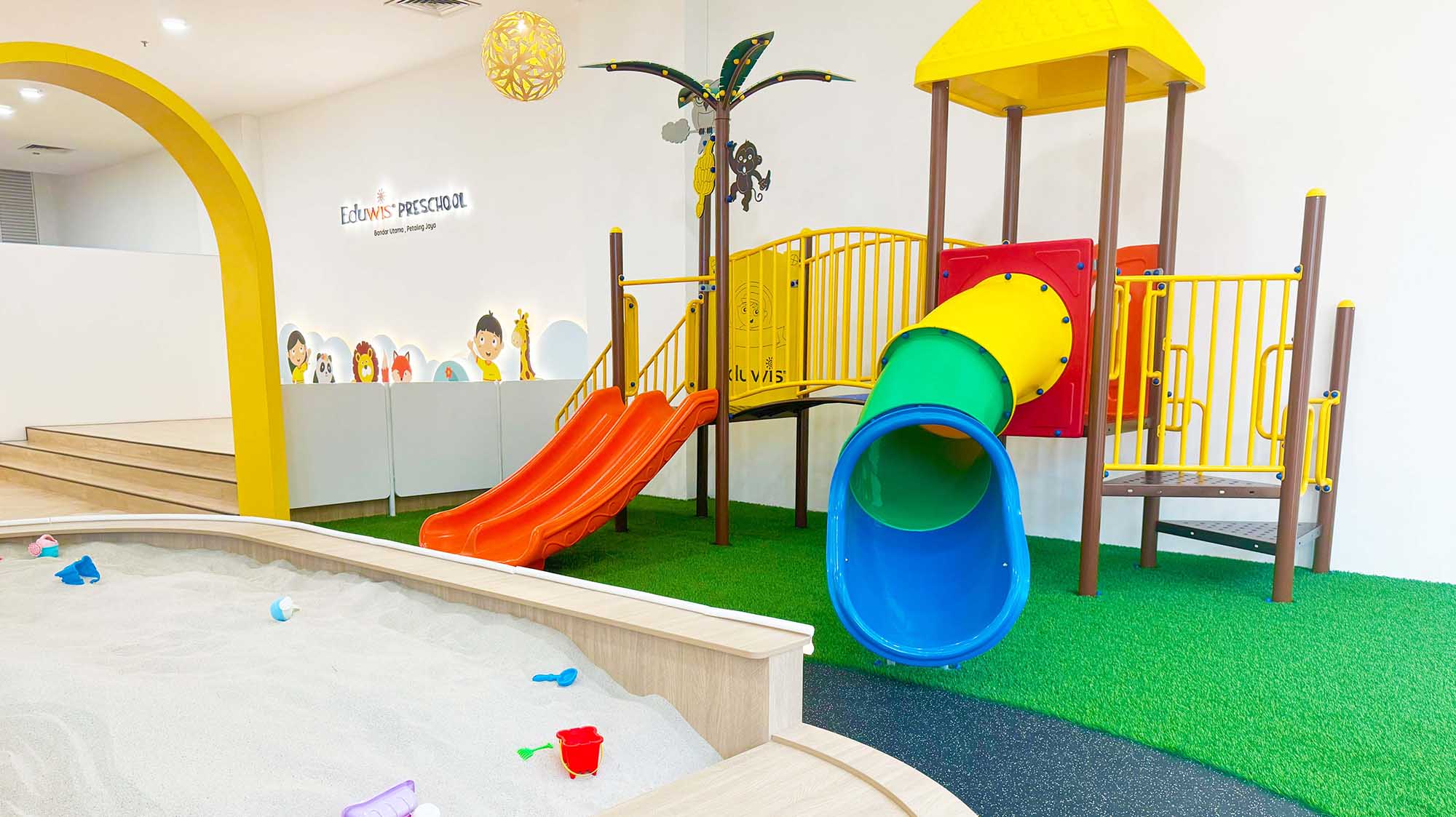 Eduwis kindergarten in Petaling Jaya with a colorful play area featuring slides, a sandbox, and engaging learning spaces designed for children’s growth and fun.