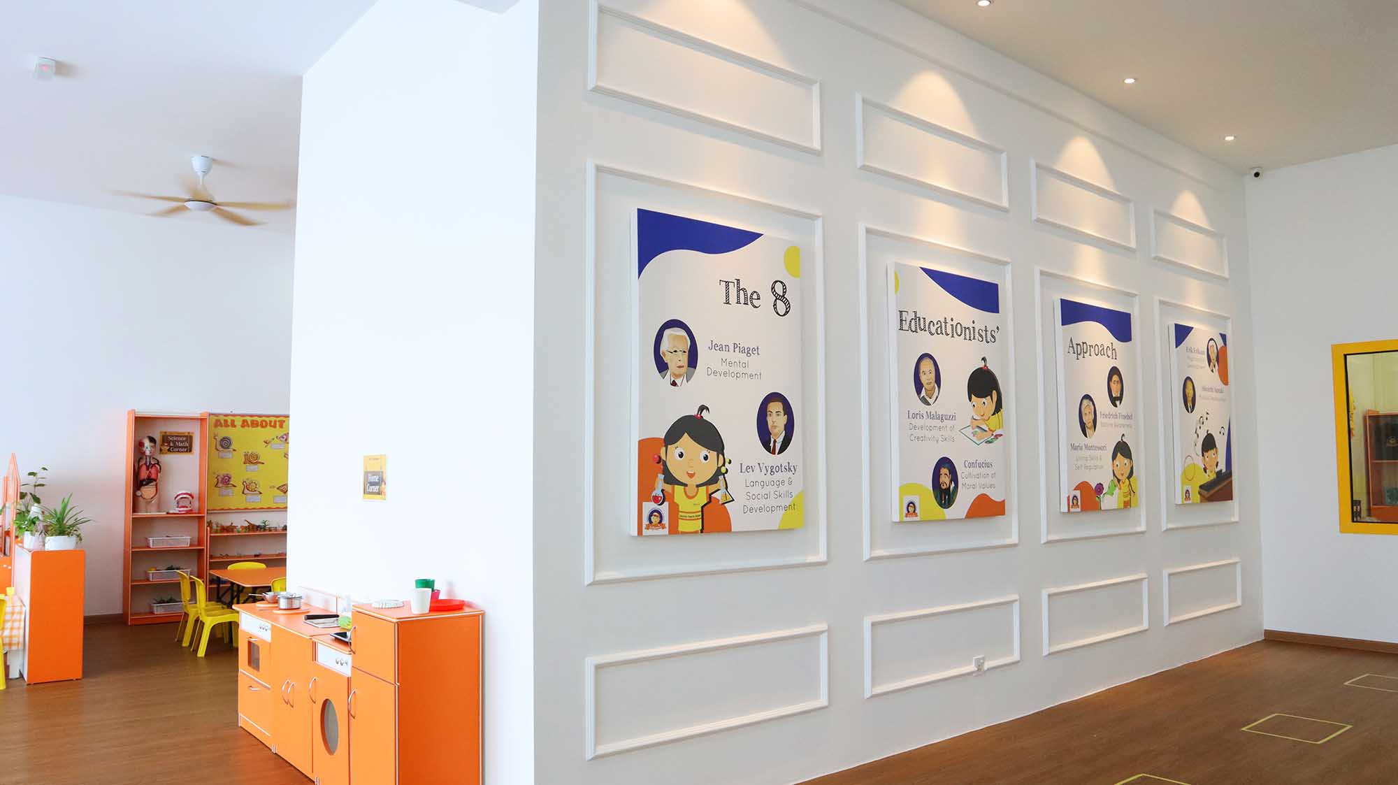 Eduwis Cyberjaya kindergarten interior with a bright red spiral slide and engaging activity spaces, providing a fun learning environment for young children.