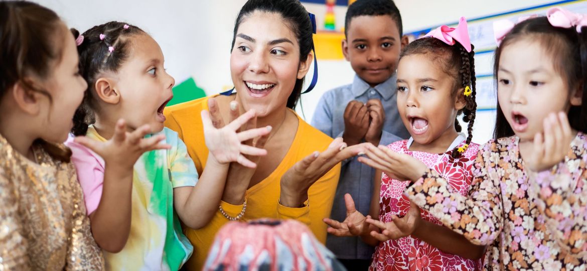 kids playing along with teacher at best preschool in KL